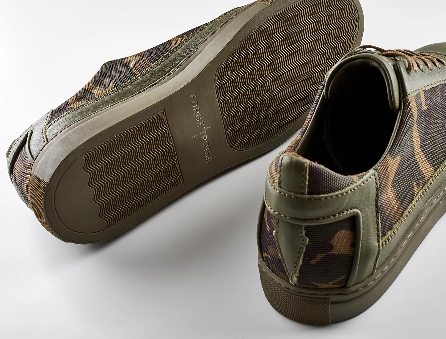 Camouflage trainers with the sole turned up